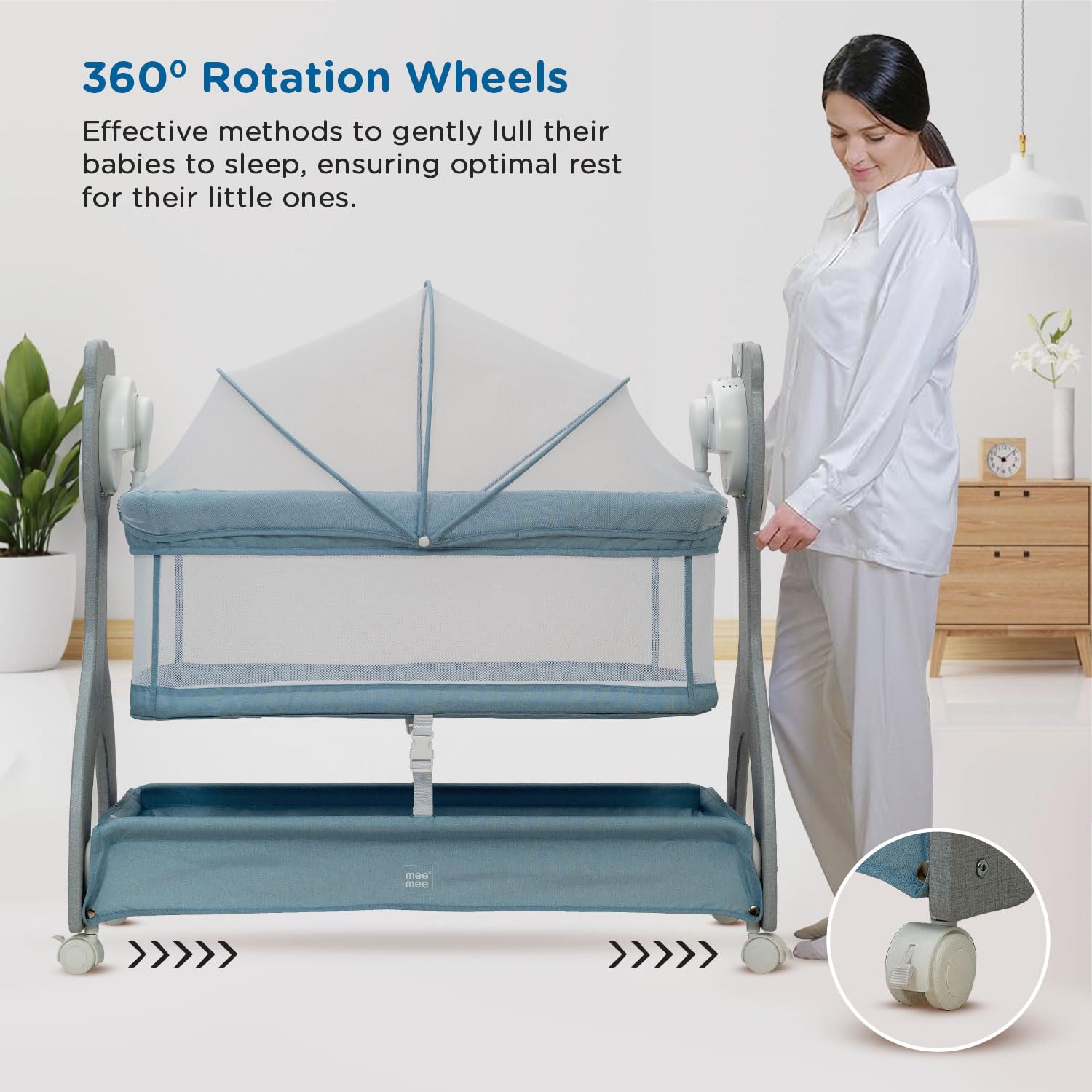 Baby crib with 360-degree rotation wheels and a woman standing next to it in a room.